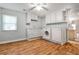 Bright laundry room with ample cabinet space and modern washer and dryer at 270 Hollyridge Way, Roswell, GA 30076