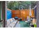 Private backyard oasis with seating, a grill, and a wooden fence for relaxation and entertaining at 8566 Jamestown Way, Jonesboro, GA 30238