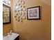Cozy powder room featuring a vanity and decorative accents, creating a charming and functional space at 8566 Jamestown Way, Jonesboro, GA 30238