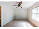 Bright bedroom featuring a ceiling fan and neutral carpet, a relaxing retreat at 8566 Jamestown Way, Jonesboro, GA 30238