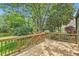 Spacious wooden deck surrounded by lush greenery, ideal for outdoor entertaining and relaxation at 1134 Jefferson Ave, East Point, GA 30344