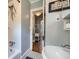 Bathroom with a sink, tub, and a view into an adjacent room featuring mosaic tile at 1134 Jefferson Ave, East Point, GA 30344