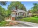 Charming home showcasing the side entrance, yard and landscaping on a sunny day at 1134 Jefferson Ave, East Point, GA 30344