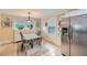 Bright eat-in kitchen with stainless steel appliances, tile floors, and a table with seating at 1134 Jefferson Ave, East Point, GA 30344