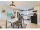 Bright kitchen with stainless steel appliances, white cabinets, tile floors, and a table with chairs at 1134 Jefferson Ave, East Point, GA 30344