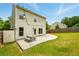 Backyard of home with stone patio, grass area, and a storage shed at 119 Hardy Water Dr, Lawrenceville, GA 30045