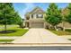 Charming two-story home with a well-manicured lawn and attached two car garage at 119 Hardy Water Dr, Lawrenceville, GA 30045