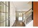 Welcoming foyer with beautiful hardwood floors and an open staircase at 119 Hardy Water Dr, Lawrenceville, GA 30045