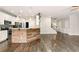 Open kitchen with a breakfast bar, stainless steel appliances, and ample counter space at 119 Hardy Water Dr, Lawrenceville, GA 30045
