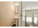 Stylish powder room with pedestal sink and hardwood flooring, conveniently located near the living area at 119 Hardy Water Dr, Lawrenceville, GA 30045