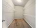 Walk-in closet with wire shelving and carpeted floor for ample storage at 119 Hardy Water Dr, Lawrenceville, GA 30045