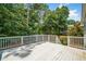 Wooden back deck perfect for outdoor entertaining with its view of the private wooded lot at 2081 Township Dr, Woodstock, GA 30189