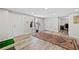 Finished basement with a large persian rug, wood-look flooring, multiple doors, a window and a finished office space at 2081 Township Dr, Woodstock, GA 30189