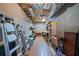 Unfinished basement storage area, shelving, and workbench providing ample space for all your storage needs at 2081 Township Dr, Woodstock, GA 30189