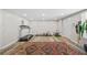 Finished basement with a large persian rug, wood-look flooring, exercise equipment and easy outdoor access at 2081 Township Dr, Woodstock, GA 30189