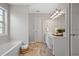 Bathroom features a soaking tub, double vanity, and large mirror with stylish lighting at 2081 Township Dr, Woodstock, GA 30189