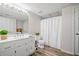 Bright bathroom featuring a white vanity, toilet, and shower/tub with modern finishes and fixtures at 2081 Township Dr, Woodstock, GA 30189
