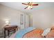 This cozy bedroom features a ceiling fan, closet, bedside table and neutral color palette at 2081 Township Dr, Woodstock, GA 30189