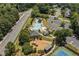 Aerial view of community pool and amenities with playground, sand volleyball and tennis courts at 2081 Township Dr, Woodstock, GA 30189