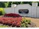 The Township Place community sign is showcased with colorful flowers in the foreground at 2081 Township Dr, Woodstock, GA 30189