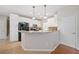 Modern kitchen with white cabinets, granite counters, and a breakfast bar at 2081 Township Dr, Woodstock, GA 30189