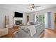 Spacious living room featuring a stone fireplace, hardwood floors, and a comfortable gray sofa at 2081 Township Dr, Woodstock, GA 30189