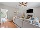 Inviting living room with hardwood floors, stone fireplace, and view into the foyer at 2081 Township Dr, Woodstock, GA 30189
