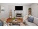 Inviting living room features a cozy fireplace and comfortable seating at 2081 Township Dr, Woodstock, GA 30189