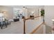 Upper room view including space for work or study, complemented by neutral décor and a railing at 2081 Township Dr, Woodstock, GA 30189
