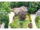 Beautiful home with pristine landscaping, lush trees, and a long private driveway at 410 Beechwood Ln, Woodstock, GA 30189