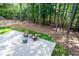 Outdoor deck with seating offers a tranquil retreat surrounded by nature's beauty at 410 Beechwood Ln, Woodstock, GA 30189