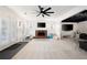 Finished basement featuring a brick fireplace and multiple TV screens for entertainment at 410 Beechwood Ln, Woodstock, GA 30189
