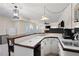 Finished basement with a large countertop, sink, refrigerator, and kitchenette at 410 Beechwood Ln, Woodstock, GA 30189