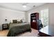 Relaxing bedroom featuring a work space with a wooden hutch and natural light at 410 Beechwood Ln, Woodstock, GA 30189