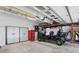 Organized garage with storage cabinets, and a golf cart parked inside at 410 Beechwood Ln, Woodstock, GA 30189