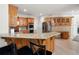 Kitchen with stainless steel appliances, wood cabinets, granite countertops, and breakfast bar at 410 Beechwood Ln, Woodstock, GA 30189