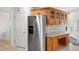 Kitchen featuring stainless steel refrigerator, granite countertops, and wood cabinets at 410 Beechwood Ln, Woodstock, GA 30189