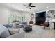 Inviting living room with comfortable seating, a fireplace, and built-in bookshelves at 410 Beechwood Ln, Woodstock, GA 30189