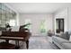 Sitting room featuring piano, hardwood floors and view of front door at 410 Beechwood Ln, Woodstock, GA 30189