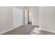 This is a cozy bedroom with a neutral carpet, a closet, and an open doorway at 726 Alfred Nw Rd, Atlanta, GA 30331
