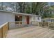Spacious wooden deck offering an ideal space for outdoor enjoyment, complete with access to the front door at 726 Alfred Nw Rd, Atlanta, GA 30331
