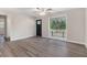 Inviting living room area with neutral walls, modern flooring, and a large window offering natural light at 726 Alfred Nw Rd, Atlanta, GA 30331