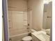 A bright bathroom with a bathtub and shower combination, complete with modern fixtures at 112 Scarlett Place Dr, Bowdon, GA 30108