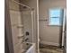 A functional bathroom with a tub and shower and vinyl floors at 112 Scarlett Place Dr, Bowdon, GA 30108