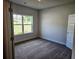 Bedroom with soft carpet and neutral walls, ready for your personal touch and decor at 112 Scarlett Place Dr, Bowdon, GA 30108