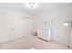 Bright bedroom features fresh white paint, plush carpet, three-drawer dresser, and closet at 2502 Tritt Springs Ne Trce, Marietta, GA 30062