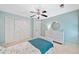 Comfortable bedroom features a ceiling fan, closet, three-drawer dresser, and a comfortable bed at 2502 Tritt Springs Ne Trce, Marietta, GA 30062