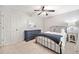 Nicely decorated bedroom with a ceiling fan, carpet, dresser, and a comfortable bed at 2502 Tritt Springs Ne Trce, Marietta, GA 30062