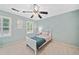 Cozy bedroom with a ceiling fan, windows for natural light, and simple furnishings at 2502 Tritt Springs Ne Trce, Marietta, GA 30062