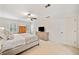 Bedroom boasts neutral colors, a ceiling fan, carpet, and a TV, and two windows for ample natural light at 2502 Tritt Springs Ne Trce, Marietta, GA 30062